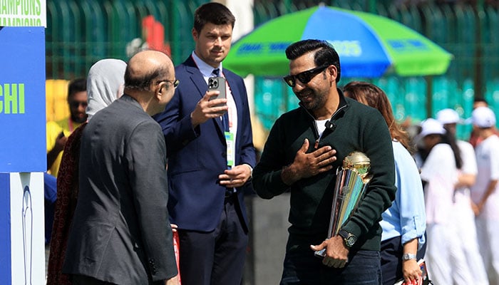 President Asif Ali Zardari interacts with former skipper Sarfaraz Ahmed during the trophy display before the match between Pakistan and New Zealand at Karachi's National Stadium on February 19, 2025. — Reuters