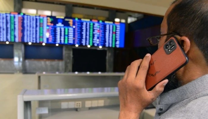 A broker is busy in trading at Pakistan Stock Exchange in Karachi on January 1, 2025. — PPI