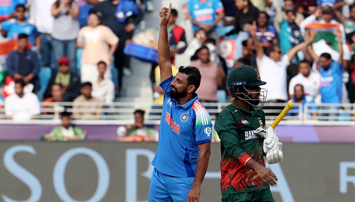 Indias Mohammed Shami celebrates after taking the wicket of Bangladeshs Tanzim Hasan Sakib. — Reuters