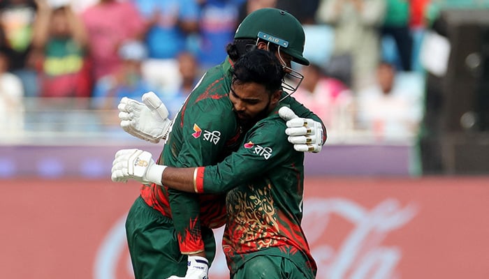 Bangladeshs Towhid Hridoy celebrates with Taskin Ahmed after reaching his century. — Reuters