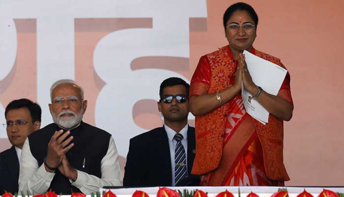 Prime Minister Narendra Modi applauds as Indias ruling Bharatiya Janata Partys Rekha Gupta greets the audience before taking her oath as the new Chief Minister of Delhi at the Ramlila grounds in New Delhi, India, February 20, 2025. — Reuters