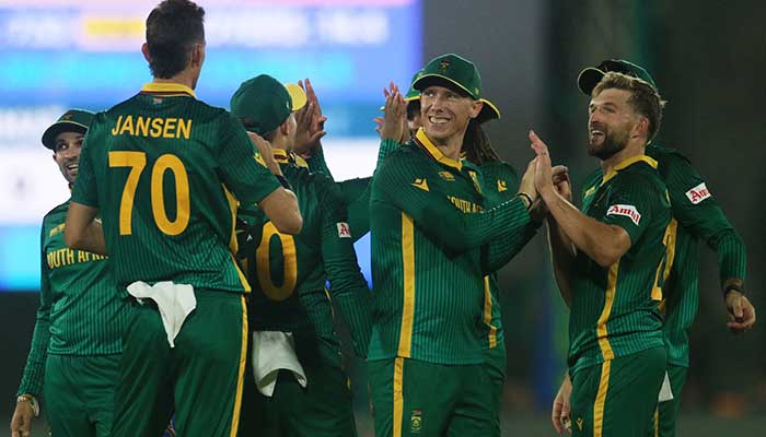 South Africas Wiaan Mulder celebrates with teammates after taking the wicket of Afghanistans Hashmatullah Shahidi during ICC Mens Champions Trophy at National Staidum, Karachi, February 21, 2025. — Reuters