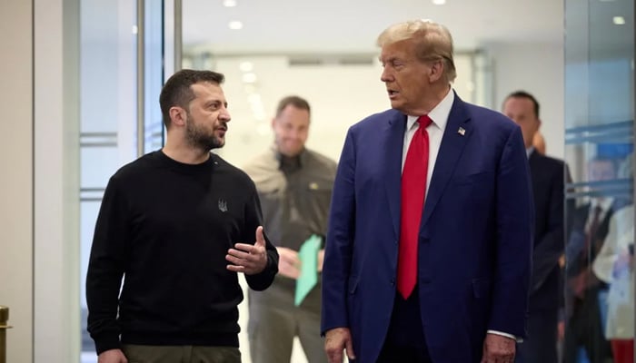 This handout photograph released by the Ukrainian presidential press service on September 27, 2024 shows Ukrainian President Volodymyr Zelensky (L) and Republican presidential nominee former US President Donald Trump meeting on September 27, 2024 in New York. — AFP