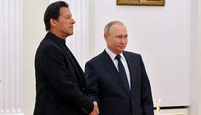 Russian President Vladimir Putin shakes hands with the then PM Imran Khan during a meeting in Moscow, Russia on February 24, 2022. — AFP