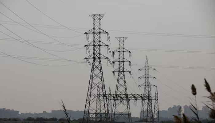 A power transmission tower in Karachi, Pakistan, January 24, 2023. - Reuters