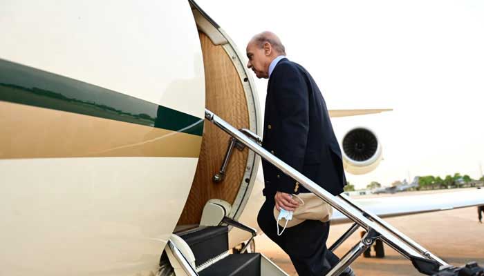 Prime Minister Shehbaz Sharif boarding a Pakistan Airforce plane as he leaves for Turkiye. — X/@PakPMO/File