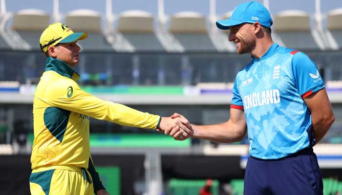 Australia captain Steve Smith (Left) shakes hand with England captain Jos Butler after the toss for their ICC Champions Trophy clash at Gaddafi Stadium, Lahore, February 22, 2025. — ICC