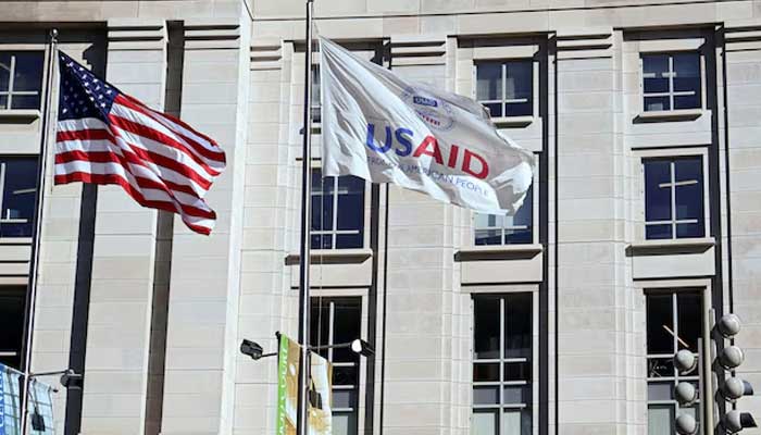 American and USAID flags fly outside the aid agencys building in Washington, DC, US, February 1, 2025. — Reuters