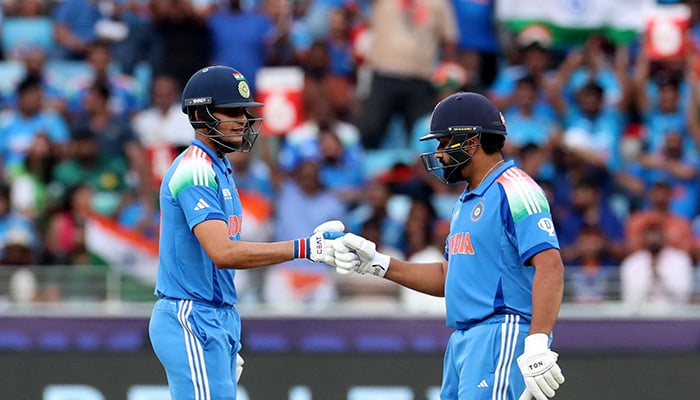 Indias Shubman Gill and Rohit Sharma bump fists during the ICC Champions Trophy 2025 match between Pakistan and India at Dubai Cricket Stadium on February 23, 2025. — Reuters