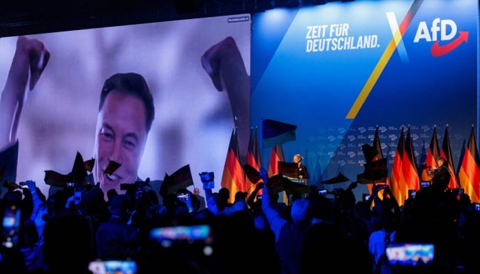 Elon Musk is seen on a large screen as Alice Weidel, co-leader of Germanys far-right Alternative for Germany (AfD) party, addresses an election campaign rally in Halle, Germany, January 25, 2025. — AFP