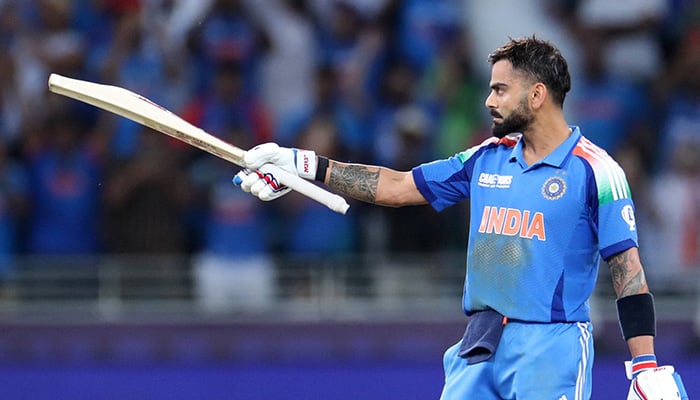 Indias Virat Kohli celebrates after hitting four runs to reach his century and win the ICC Champions Trophy 2025 match against Pakistan at Dubai Cricket Stadium on February 23, 2025. — Reuters