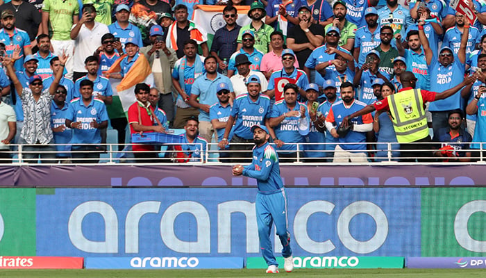 Indias Virat Kohli celebrates after taking a catch to dismiss Pakistans Khushdil Shah off the bowling of Harshit Rana. — Reuters