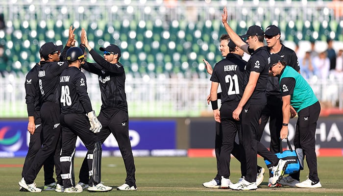 New Zealands Rachin Ravindra celebrates after taking the catch to dismiss Bangladeshs Mushfiqur Rahim, off the bowling of Michael Bracewell