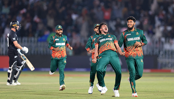 Bangladeshs Taskin Ahmed celebrates with teammates after taking the wicket of New Zealands Will Young. — Reuters