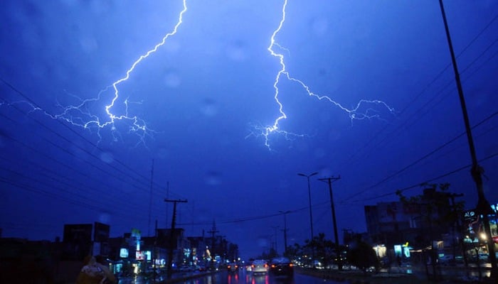 A lightning is represented on Lahore City during a thunder storm which was followed by heavy rains on April 13, 2012. - AFP