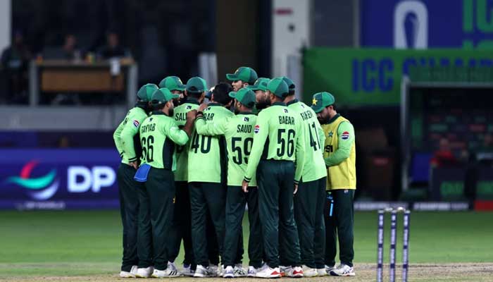 Pakistan players get into a huddle while trying to defend 241 against India during high-stakes clash of ICC Champions Trophy 2025, Dubai, February 23, 2025. — AFP