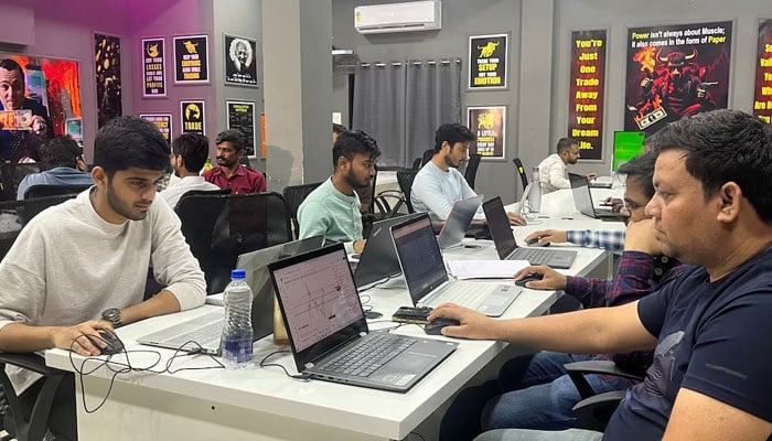 Students attend an evening class for equity and crypto trading at the Thoughts Magic Trading academy in Nagpur, India, February 13, 2025. — Reuters