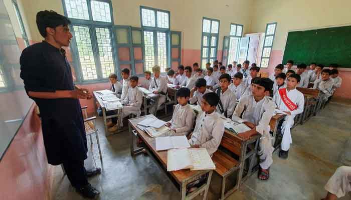 A school teacher teaching young kids at a Pakistani school. — Reuters/File