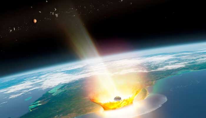 An artists impression of a large asteroid impacting at Chicxulub on the Mexican coastline, which caused the end-Cretaceous mass extinction, 66 million years ago, with the planet Mars and asteroid bodies in the background, in this image obtained by Reuters on August 14, 2024. — Reuters