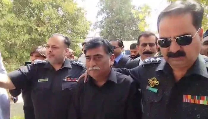 Mohajir Qaumi Movement-Haqiqi Chairman Afaq Ahmed is being escorted by police personnel during his appearance at an Anti-Terrorism Court in Karachi on February 12, 2025. — Reporter