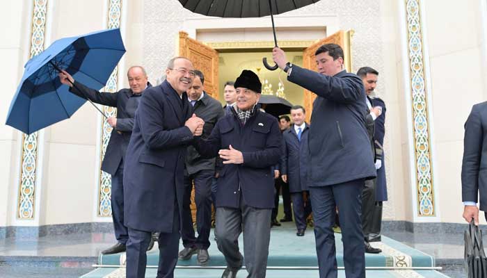 Uzbekistan’s Prime Minister Abdulla Aripov (left) receives Prime Minister Shehbaz Sharif upon his arrival in Tashkent on February 25, 2025. — PID