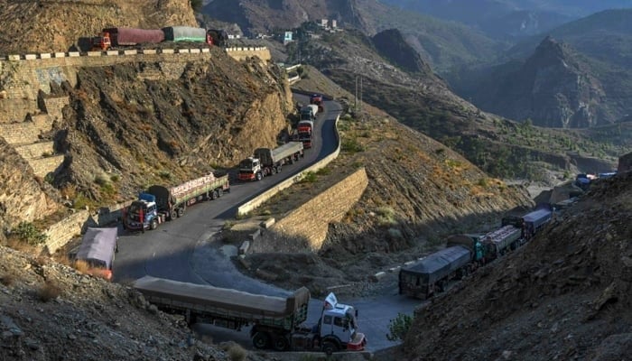 Trucks are seen parked along a road near the Pakistan-Afghanistan border in Torkham seen in this image, on September 11, 2023, — AFP