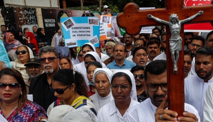 Members of the Christian community chant slogans as they gather to condemn the attacks on churches and houses in Jaranwala town of Faisalabad, during a protest in Karachi, August 18, 2023. — Reuters