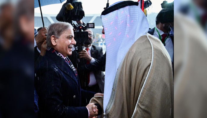 Prime Minister Shehbaz Sharif (left) welcomes Abu Dhabi Crown Prince Sheikh Khaled bin Mohamed bin Zayed Al Nahyan at Noor Khan Base in Islamabad on February 27, 2025. — PID