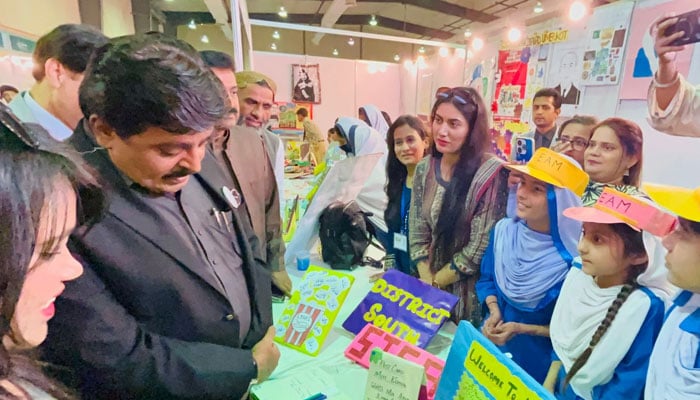 Sindh’s Minister for Education Syed Sardar Ali Shah (second from left) visits a stall during the festival at at Karachi Expo Center. — Sindh Education Ministry