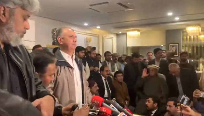 PTI leader Omar Ayub Khan (3rdd from left) addresses press conference following TTAP meeting in Islamabad on February 27, 2024. — X/@PTIofficial/screengrab