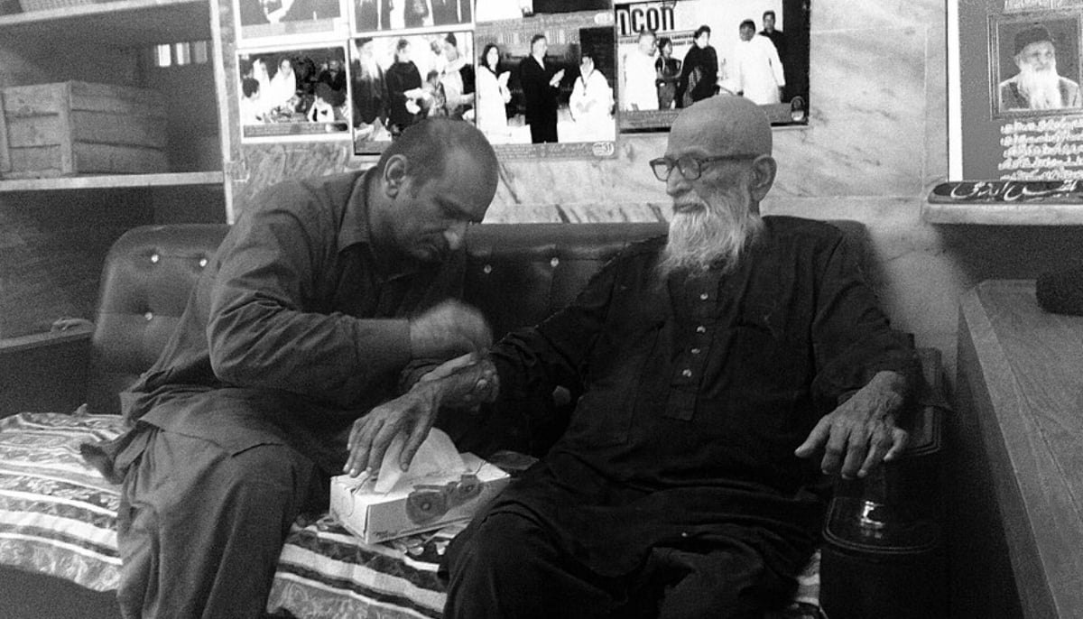 Faisal Edhi (left) with his father Abdul Sattar Edhi at the Meethadar centre. — Yasmin Jaffri/File