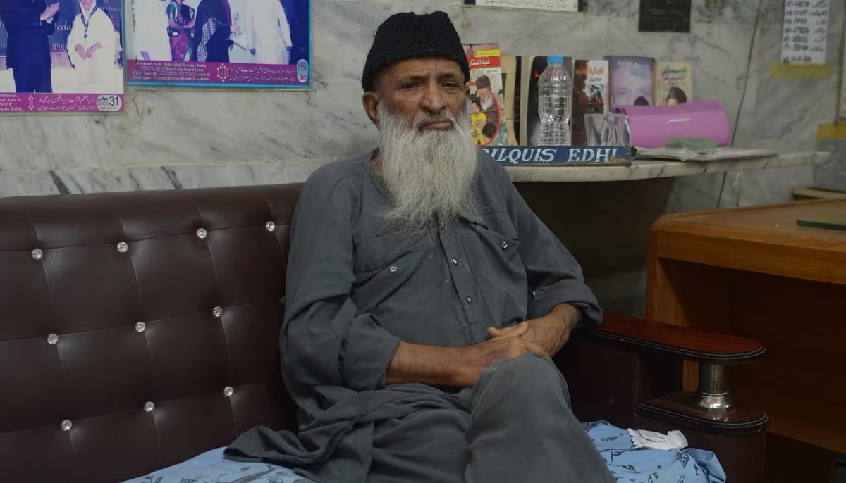 Abdul Sattar Edhi is seen seated in his office in Karachi. — AFP/File