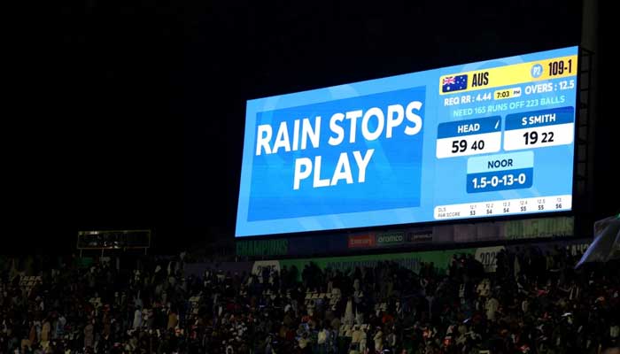 This picture shows a general view inside the Gadaffi Stadium in Lahore as a big screen displays a message stating that the ICC Mens Champions Trophy 2025 match between Australia and Afghanistan has been stopped due to rain on February 28, 2025. — ICC