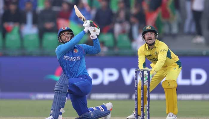 Australian wicket-keeper Josh Inglis watches Azmatullah Omarzai’s slog sweep sail for six during their ICC Champions Trophy 2025 clash at the Gaddafi Stadium, Lahore, February 28, 2025. — ICC