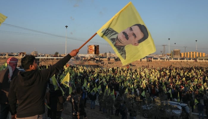 Syrian Kurds hold flags as they gather after Turkeys jailed militant leader Abdullah Ocalan called on his Kurdistan Workers Party (PKK) to lay down its arms on Thursday, in Hasakah, Syria February 27, 2025. — Reuters