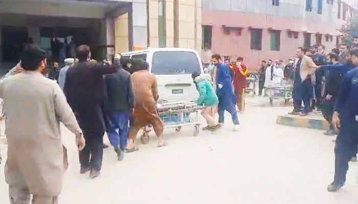 People gathered outside a medical facility after a blast ripped through Darul Uloom Haqqania, Akora Khattak, Nowshera, on February 28, 2025. — Geo News