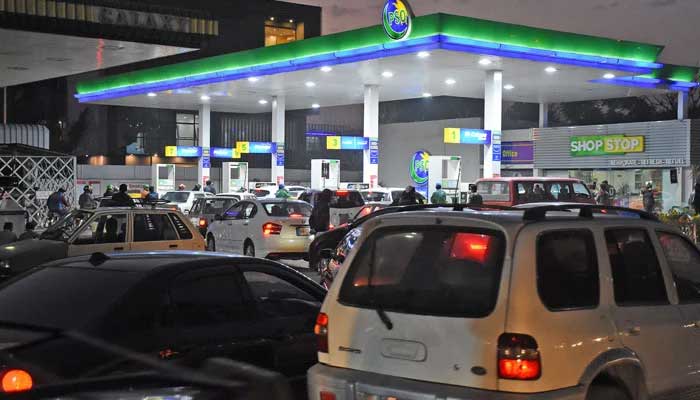 Vehicles lined up with Pakistan oil fuel pump in this undated photo. - Online / File