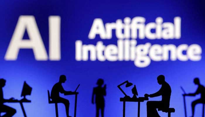 Figurines with computers and smartphones are seen in front of the words Artificial Intelligence AI in this illustration taken, February 19, 2024. — Reuters