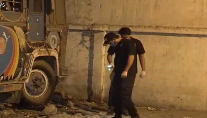 Investigators examine the crime scene at Preddy Police Station in Karachi, following a cracker attack on March 1, 2025. — Screengrab/Geo News