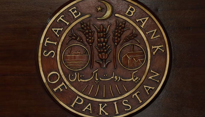 A logo of the State Bank of Pakistan is represented on a reception at the headquarters of Karachi on July 16, 2019 - Reuters