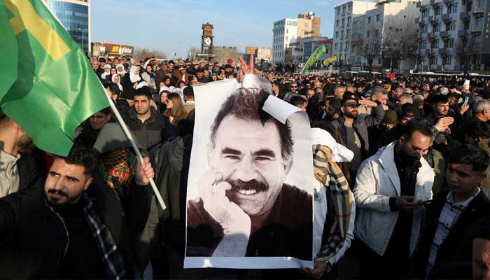 A demonstrator holds a picture of jailed Kurdish militant leader Abdullah Ocalan during a rally in Diyarbakir, Turkey, February 27, 2025. — Reuters