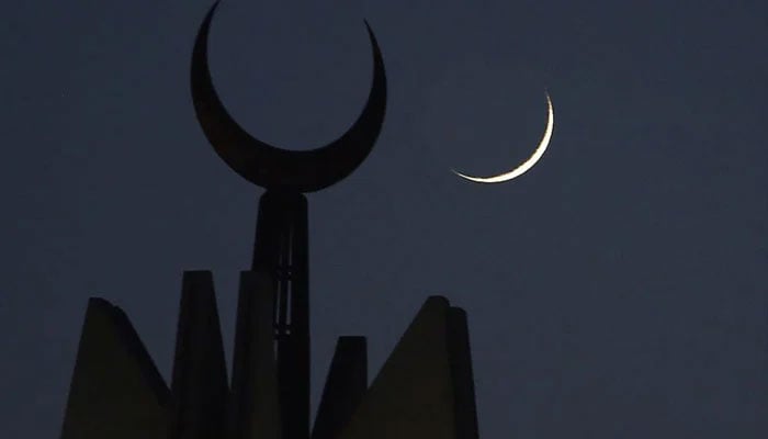 New crescent seen on the sky in the background of a mosques minaret in this undated image. — AFP/File