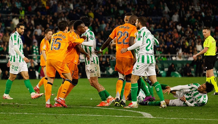 Real Madrids Vinicius Junior and Real Madrids Antonio Rudiger clash with Real Betis Marc Bartra as Real Madrids Arda Guler intervenes on March 1, 2025. — Reuters