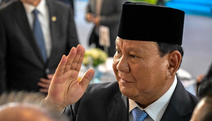 Indonesian President Prabowo Subianto greets guests during the launch of a sovereign wealth fund known as Daya Anagata Nusantara, or Danantara, in Jakarta on February 24, 2025. — AFP