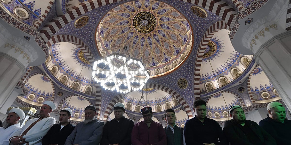 Kyrgyz Muslim worshippers pray inside the Abdulkarim Satuq Bughra Khan Mosque during the start of Ramadan in Bishkek on February 28, 2025.  — AFP