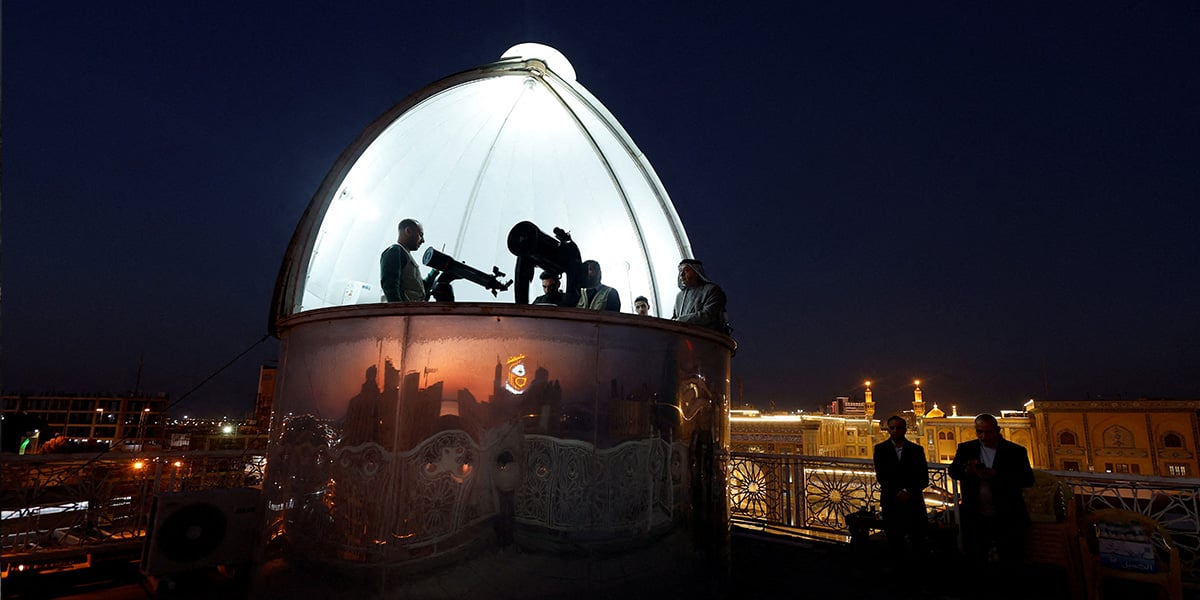 People look through binoculars and a telescope to view the new moon to mark the beginning of the holy fasting month, in the city of Najaf, Iraq, February 28, 2025. — Reuters