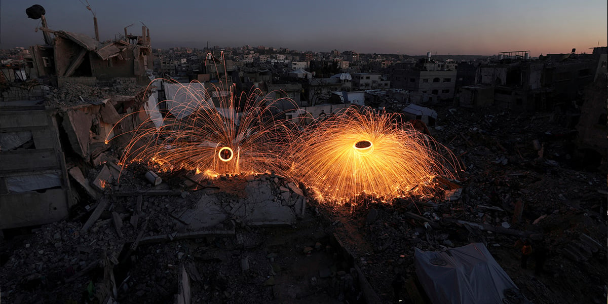 Palestinians spin steel wool sparklers amid the rubble of buildings, ahead of the holy fasting month of Ramadan in Gaza on February 28, 2025. — Reuters