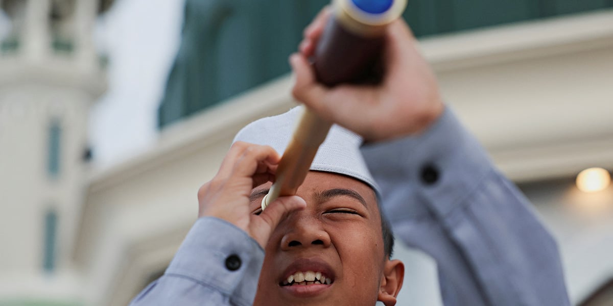 A boy looks for the position of the moon on the roof of Al-Musyariin mosque in Jakarta, Indonesia, February 28, 2025. — Reuters