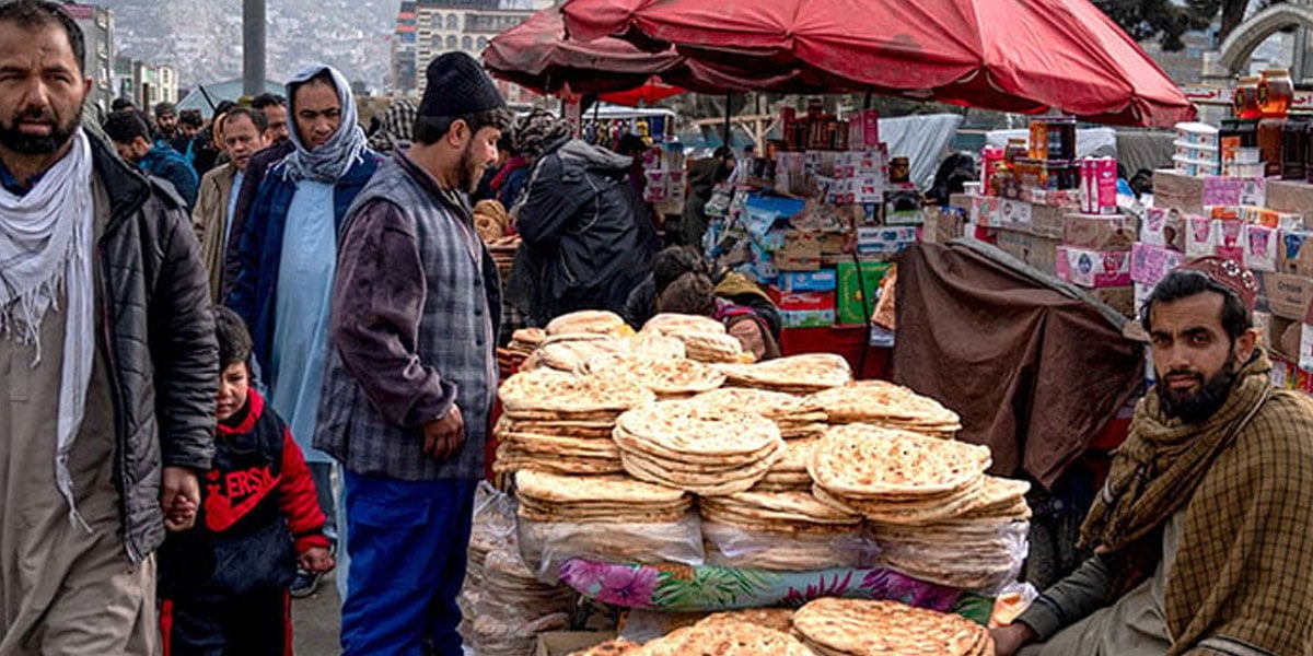 An Afghan man sells traditional flatbreads known as naan in Kabul on February 27, 2025. — AFP