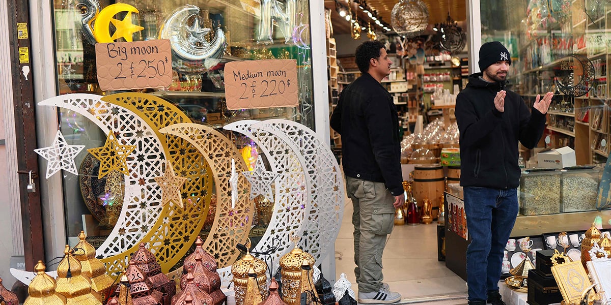 A man watches as people participate in a Ramadan parade on Fifth Avenue in the Bay Ridge neighbourhood on February 28, 2025 in the Brooklyn borough in New York City. — AFP